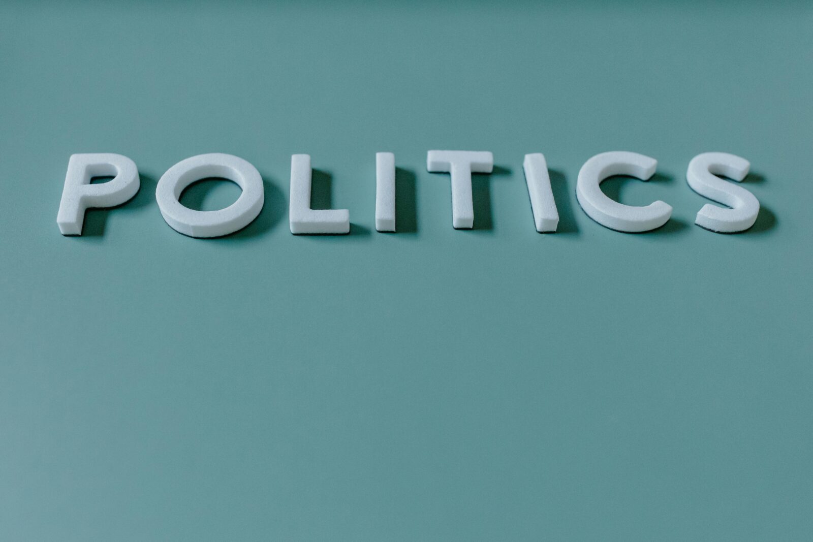 Politics Text on Green Background
